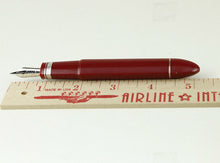 Load image into Gallery viewer, Close up of the pen without the cap placed next to a ruler. It measures 5.25 inches.
