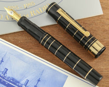 Load image into Gallery viewer, Front view of the fountain pen with the cap next to it. 
