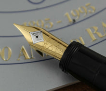 Load image into Gallery viewer, Close up to the two-toned nib with engraved decorations and text, 1895-1995, OMAS, 750, 18K
