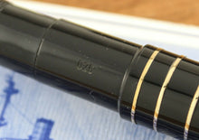 Load image into Gallery viewer, Close up to the limited edition number  026 engraved by the grip section. 
