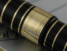 Load image into Gallery viewer, Close up to the OMAS logo engraved on the cap ring. 
