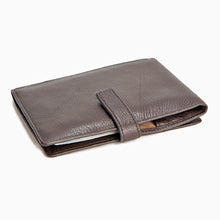 Load image into Gallery viewer, Angled view of the Espresso brown leather passport holder.
