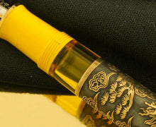 Load image into Gallery viewer, Close up to the translucent yellow demonstrator window on the barrel. 
