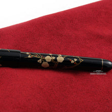 Load image into Gallery viewer, Close up to the flowers painted on the pen barrel. 

