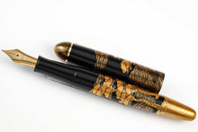 Load image into Gallery viewer, Front view of the fountain pen arranged with the cap next it on a white background. 
