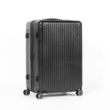 Load image into Gallery viewer, Angled front panel view of the black suitcase on a white background. 
