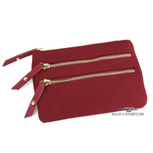 Load image into Gallery viewer, Front view of the red cosmetic bag with two front zipper compartments. 
