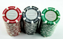 Load image into Gallery viewer, Close up to three sealed stacks of poker chips. Made in red, black, and green.
