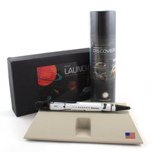 Load image into Gallery viewer, The Discovery pen arranged with the Launchpad pen holder and packaging. 
