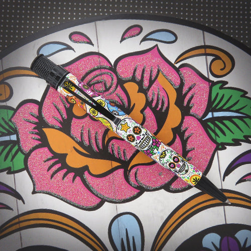 Front view of the pen on a decorated calavera background.