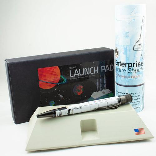 The Enterprise pen arranged on the launchpad with packaging.