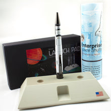 Load image into Gallery viewer, The Enterprise pen arranged with the launchpad and packaging.
