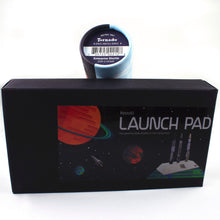 Load image into Gallery viewer, Front view of the launch pad box and product label view of the Enterprise gift tube.
