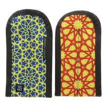 Load image into Gallery viewer, The front and back panel views of the double pen sleeves with blue, red and yellow geometric designs. THE MET logo is featured at the bottom.
