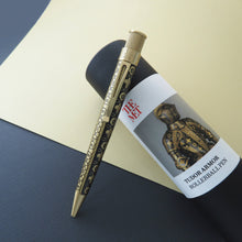 Load image into Gallery viewer, Front view of the Tudor armor pen leaning on the pen tube. 
