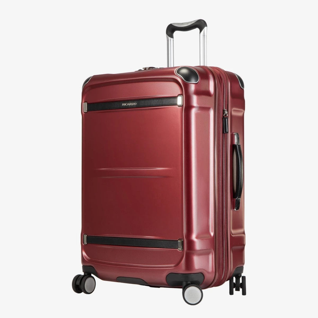 Angled front panel view of the red hard shell suitcase. 