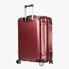 Load image into Gallery viewer, Angled back panel view of the red hard shell suitcase. 
