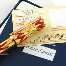 Load image into Gallery viewer, Close up to the pen cap with the sun design, resting on the documents. 
