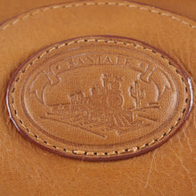 Load image into Gallery viewer, Close up to the Santa Fe logo stamped in the leather. 
