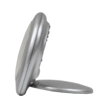 Load image into Gallery viewer, Side view of the watch with the face cover used as a stand.
