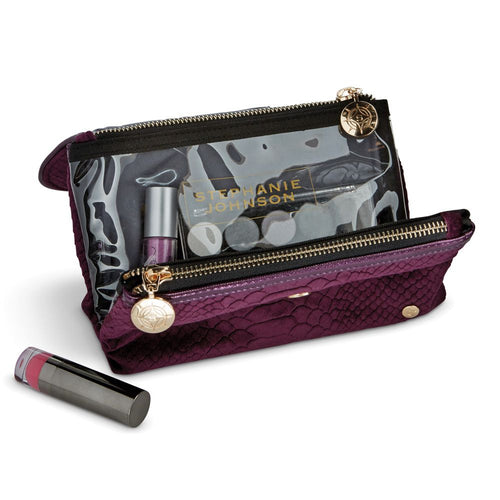 Interior view of the plum bag with cosmetics