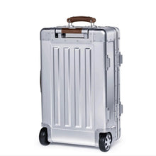 Load image into Gallery viewer, Angled back view of the suitcase. 

