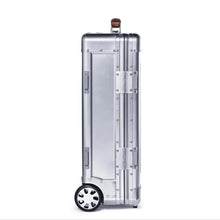 Load image into Gallery viewer, Side panel view of the suitcase. 
