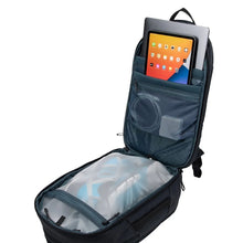 Load image into Gallery viewer, Interior view of the backpack filled with travel accessories, and electronics.
