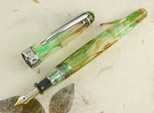 Load image into Gallery viewer, Taccia Spotlight Forest Eye Demonstrator Fountain Pen, Uncapped
