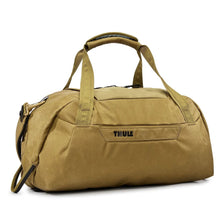 Load image into Gallery viewer, Angled front panel view of the nutria brown duffle bag with the grab handles attached with the velcro strap. 
