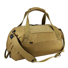 Load image into Gallery viewer, Angled front panel view of the nutria brown duffle bag with the shoulder strap attached. 

