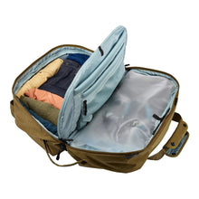 Load image into Gallery viewer, Interior view of the nutria brown bag filled with clothing. (Accessories not included).
