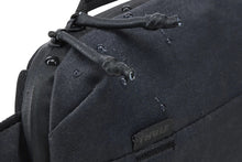 Load image into Gallery viewer, Close up to the side panel with water droplet on the fabric, showing the waterproof feature.
