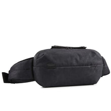Load image into Gallery viewer, Angled front panel view of the black sling bag.
