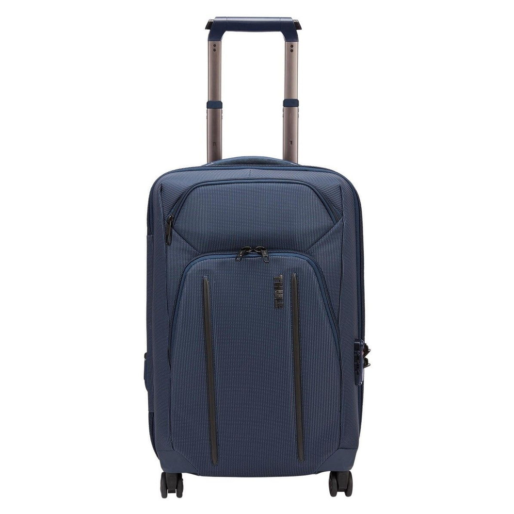 Front panel view of the blue suitcase with the telescopic handle extended. 