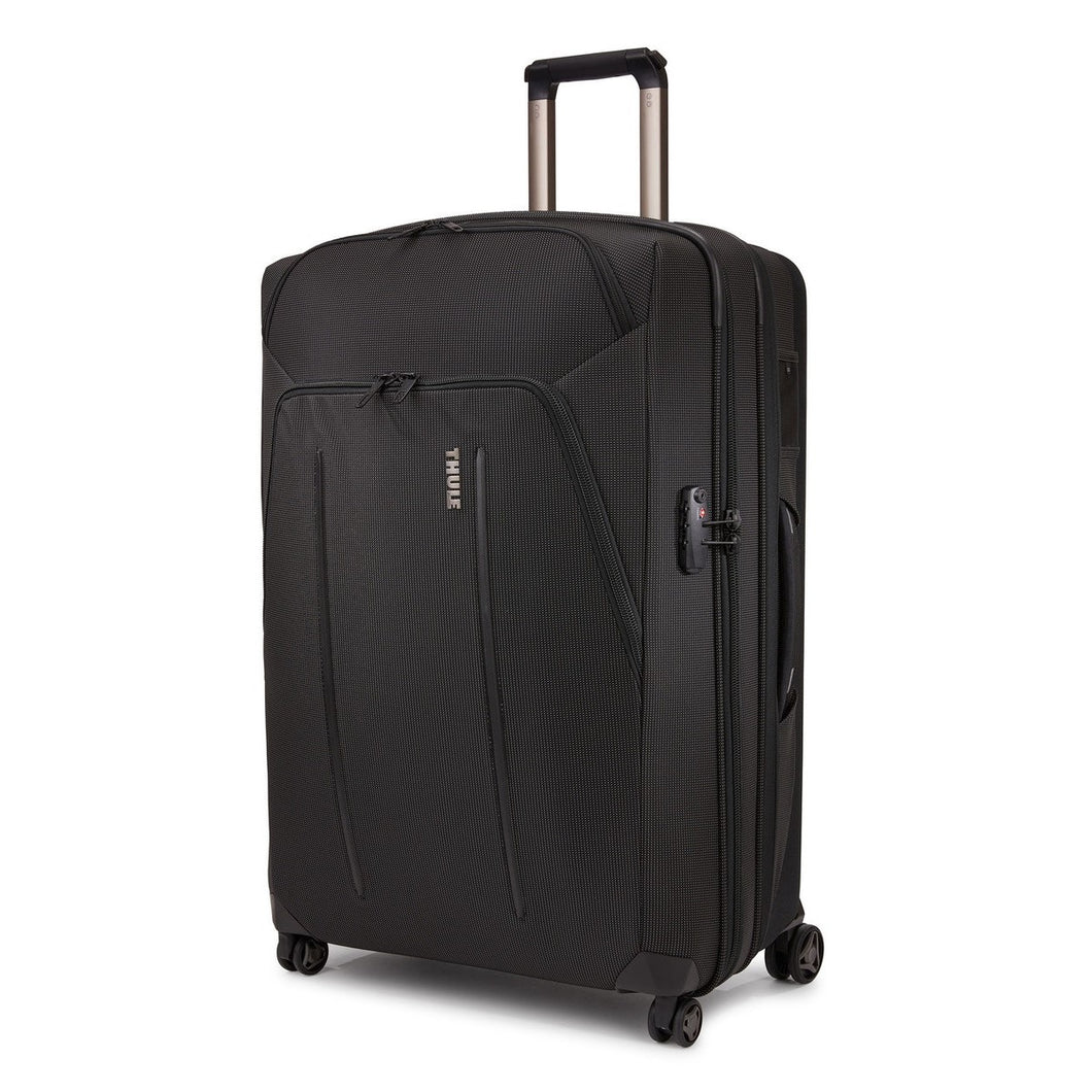 Angled front panel view of the black suitcase. 