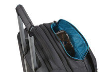 Load image into Gallery viewer, Angled view of the top suitcase with the top pocket unzipped. A pair of sunglasses are fitted inside. (Accessories not included).
