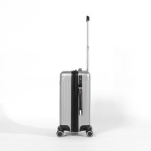 Load image into Gallery viewer, Side panel view of the silver colored suitcase. 
