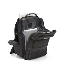 Load image into Gallery viewer, Angled front panel view of the backpack with the compartments unzipped. A tablet is inside the main compartment&#39;s pocket, and a laptop is peeking from the back panel.
