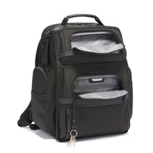 Load image into Gallery viewer, Angled front panel view of the backpack with the pockets unzipped. A key sling hangs from the inside of the bottom pocket. 
