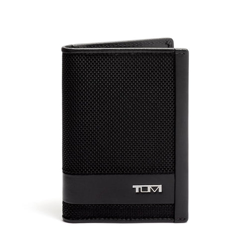 Front panel view of the card case. A small Tumi logo is shown at the bottom right. 