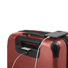 Load image into Gallery viewer, Angled close up to the back of the suitcase. Behind the telescopic handle, there is a hidden panel where you can write your name and contact information.
