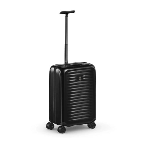 Angled front panel view of the black suitcase. 