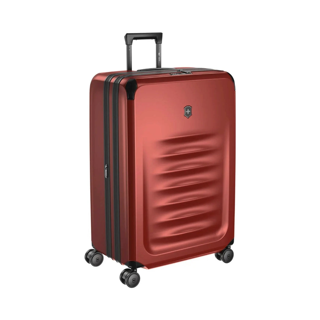 Angled front view of the suitcase with the telescopic handle partly extended.