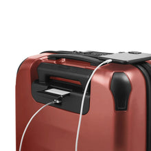 Load image into Gallery viewer, Angled close up with the top of the suitcase showing a USB slot to charge your devices. (You must connect your own power supply for this function). Underneath the handle, a hidden slot contains a name and contact information tag.
