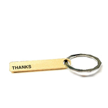 Load image into Gallery viewer, A rectangular brass colored key chain on a key ring with the phrase THANKS. The back definition reads: A word of praise for much appreciated effort. A way of saying &quot;we are even, and i can ask for a favor again&quot;. See also: amazing, wonderful, grateful.
